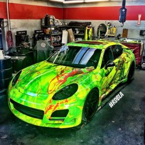 Porsche wrapped in custom printed 3M 1080 Satin Fluorescent Neon Yellow vinyl