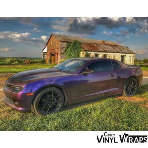 Chevrolet Camaro wrapped in Avery ColorFlow Gloss Roaring Thunder Blue/Red shade shifting vinyl