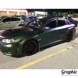 Subaru wrapped in Avery Satin Urban Jungle Silver/Green/Purple shade shifting vinyl