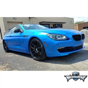 BMW 650i wrapped in Satin Perfect Blue vinyl