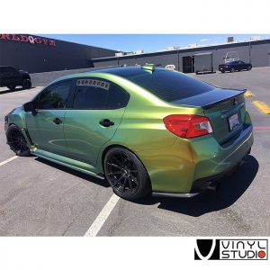 Subaru WRX wrapped in Avery Gloss Fresh Spring Gold/Silver shade shifting vinyl