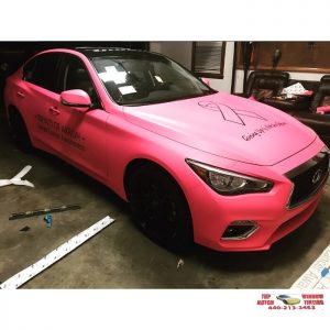 Infiniti Q50 wrapped in Matte Pink vinyl