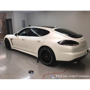 Porsche Panamera wrapped in Satin Pearl White vinyl