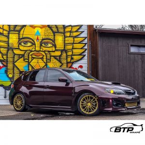 Subaru WRX wrapped in Gloss Black Rose vinyl