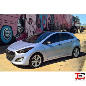 Hyundai Elantra wrapped in Avery SW Gloss Quick Silver Metallic vinyl