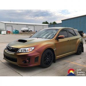 Subaru Sti wrapped in Avery ColorFlow Satin Rising Sun Red/Gold shade shifting vinyl