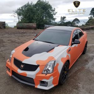 Cadillac CTSV wrapped in Arlon 2600 LX Sunkiss Aluminum Orange and Avery SW Gloss Grey vinyl custom camo