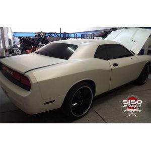 Dodge Challenger wrapped in Satin Pearl White vinyl