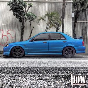 Mazda Protege wrapped in Gloss Intense Blue vinyl