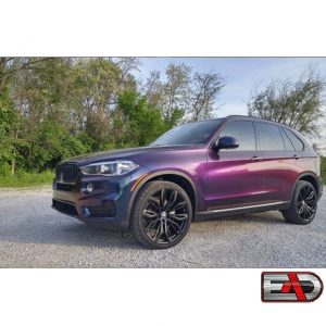 BMW X5 wrapped in ColorFlip Deep Space Blue/Bronze/Purple shade shifting vinyl