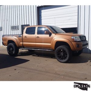 Toyota Tacoma wrapped in Matte Copper Metallic vinyl