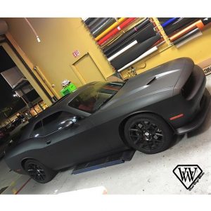 Dodge Challenger wrapped in Matte Deep Black vinyl