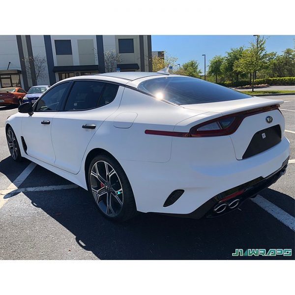 Kia Stinger wrapped in 3M 1080 White Carbon Fiber vinyl