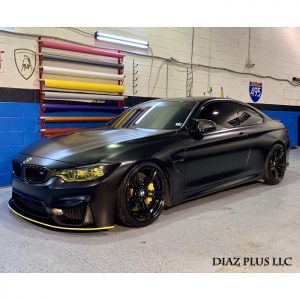 Bmw M4 wrapped in Avery SW Satin Black vinyl