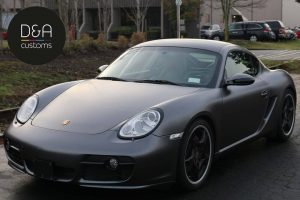 Porsche Cayman wrapped in 3M 1080 Satin Dark Gray vinyl