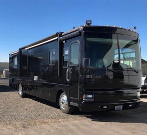 Bus wrapped in Gloss Black vinyl