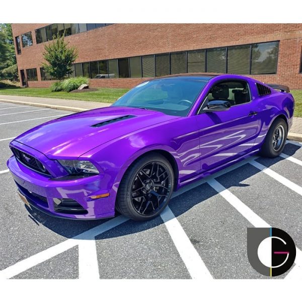 Ford Mustang wrapped in 3M 1080 Gloss Plum Explosion vinyl