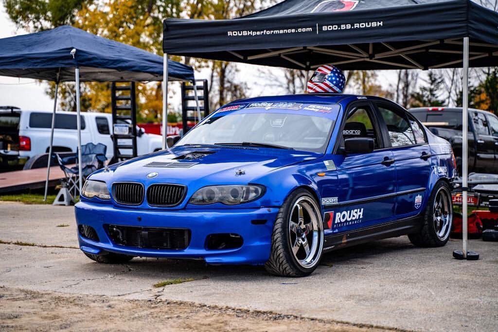 Bmw 350i wrapped in Gloss Berry Blue vinyl