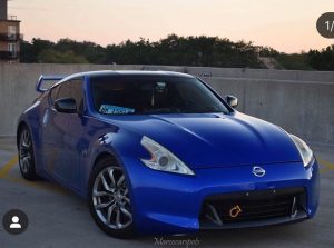 Nissan 370z wrapped in Gloss Berry Blue vinyl